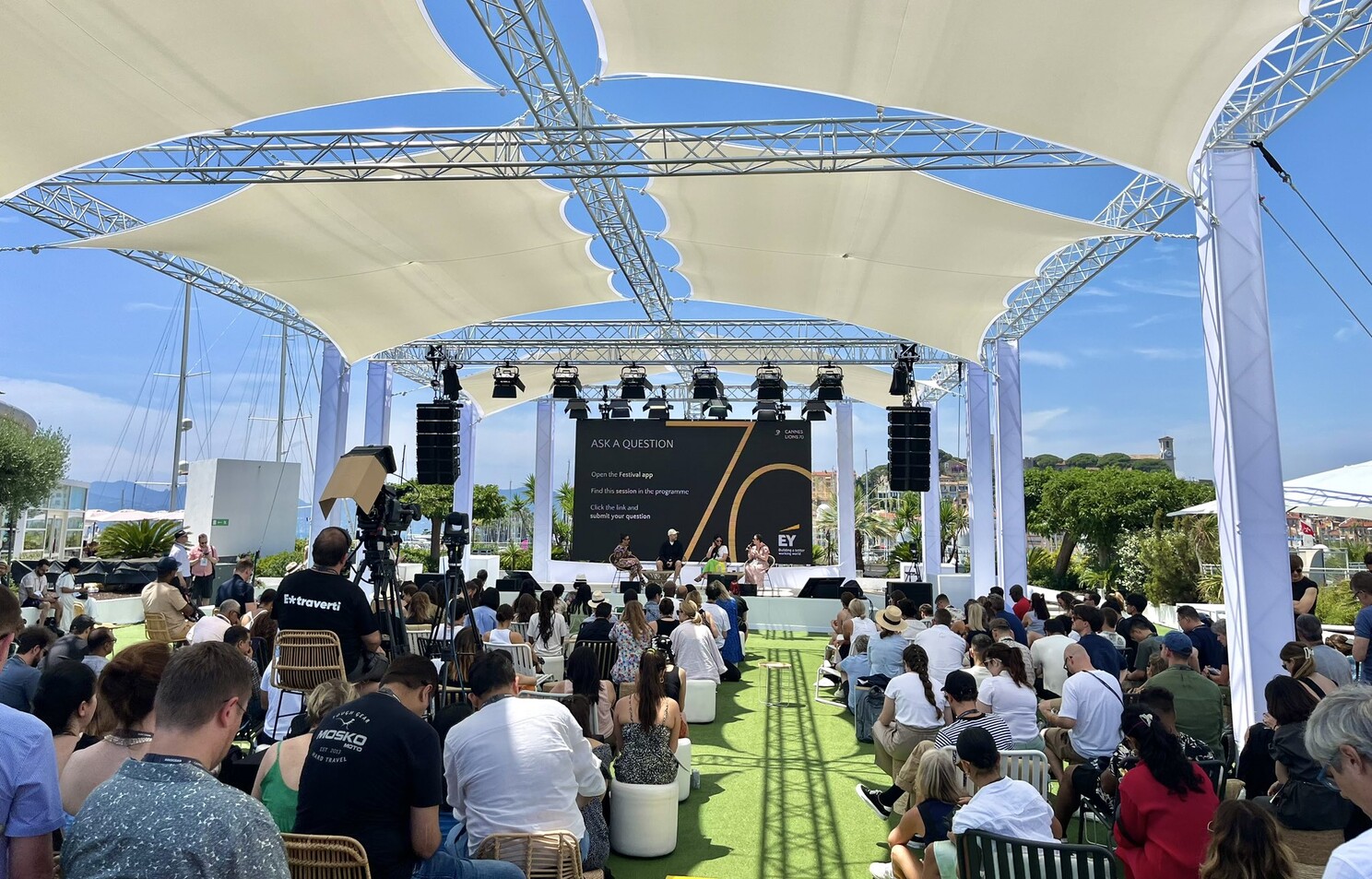 Cannes Lions outdoor stage at the Palais des Festivals, audience watching panel discussion