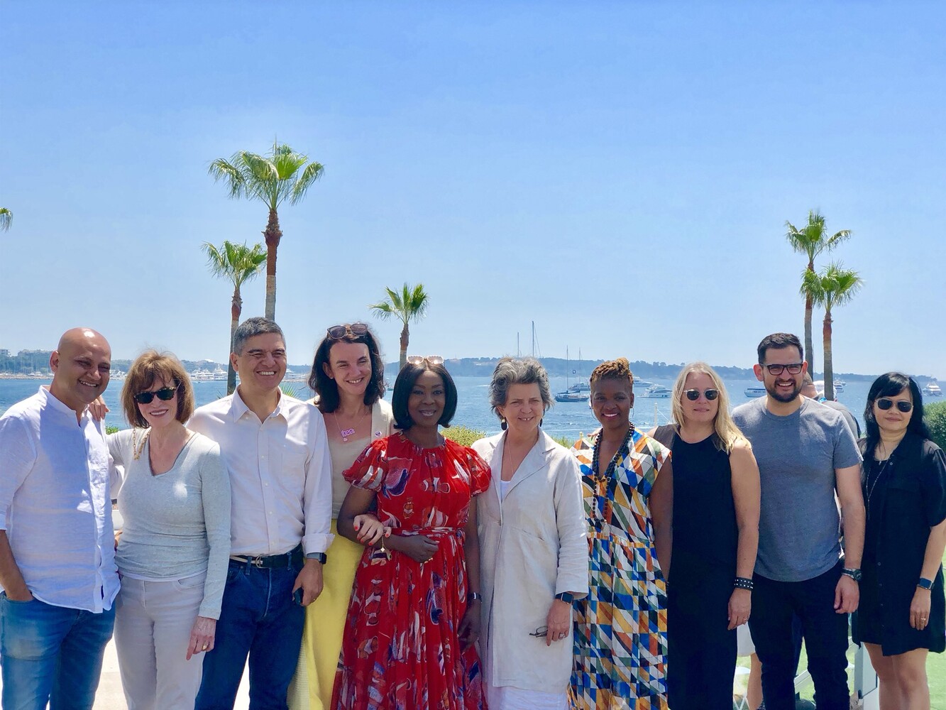 Cannes Lions jury and delegates group photo with the Mediterranean and yachts in the background