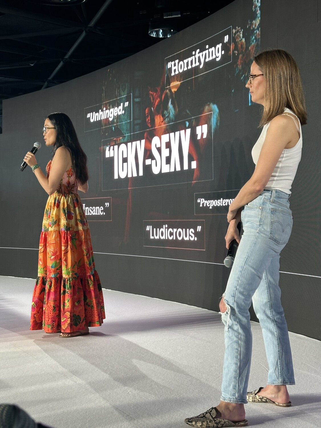 Two presenters on stage at Cannes Lions discussing the New Zealand Herpes Foundation campaign